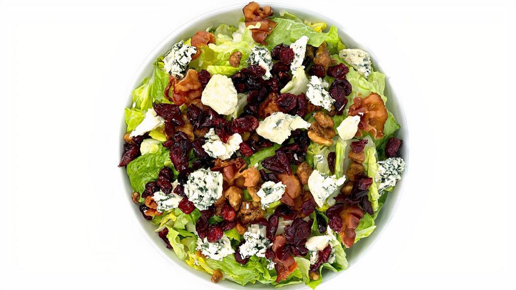 Chicken Gorgonzola Salad · Romaine lettuce, dried cranberries, honey roasted walnuts, bacon, crumbled gorgonzola cheese, and balsamic vinaigrette topped with grilled chicken.