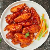 House Of Buffalo Wings · Fresh chicken wings, fried until golden brown, and tossed in house buffalo sauce. (Medium Sp...
