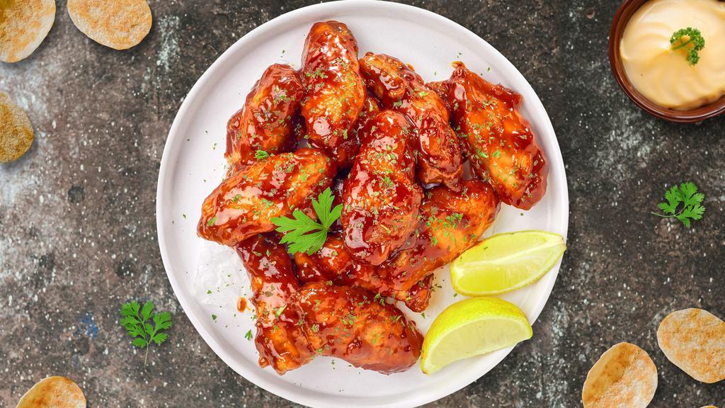 Chipotle Sweet Glaze Wings · Fresh chicken wings, fried until golden brown, and tossed in honey chipotle sauce. (Medium Spicy).