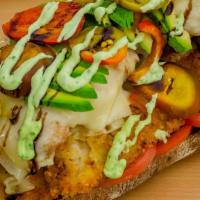 Breaded Chicken Cutlet Sandwich · Avocado, melted cave aged Gruyère, tomato, hot peppers, and herb mayonnaise on a toasted cia...