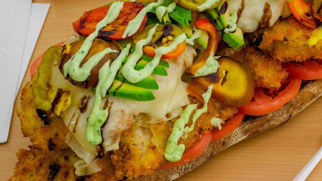 Breaded Chicken Cutlet Sandwich · Avocado, melted cave aged Gruyère, tomato, hot peppers, and herb mayonnaise on a toasted ciabatta.