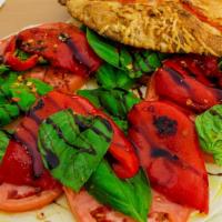 Fresh Mozzarella · Sliced tomatoes, roasted peppers, basil with extra virgin olive oil, cracked pepper, and sea...