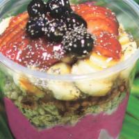 Pitaya Bowl · Organic pitaya blended w/strawberries,  local banana, pineapple, coconut  milk.  Topped with...