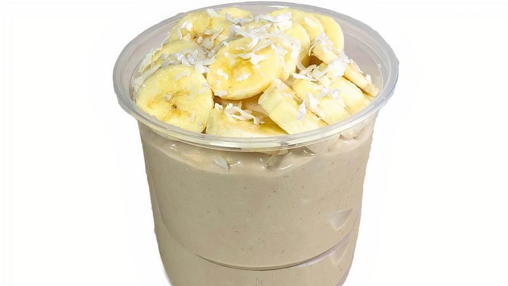 Super Monkey Smoothie Bowl · Blend: local banana, organic soymilk, peanut butter, whey protein, vegan soy cream
Topped w/organic granola, shredded coconut and fresh local banana.