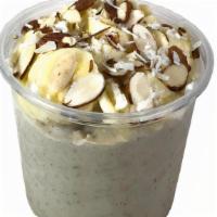 Nutty Almond Smoothie Bowl · Blend: roasted almonds, coconut milk, local banana, vegan soy cream.
Topped w/organic granol...