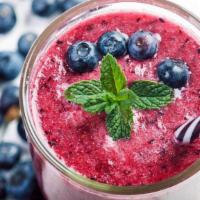 Wild Berry Smoothie · Strawberries, blueberries, raspberry and  blackberry puree