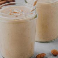 Almond Coconut Smoothie · Roasted almonds, coconut milk, local banana,  organic soymilk, honey