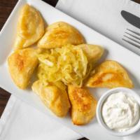 Cheese & Potato Pierogi · Cheese and potato. Seven pieces. Served with fried onions. Vegetarian.
