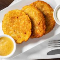 Potato Pancakes · Three home made  pieces served with sour cream and apple sauce. Vegetarian.