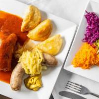Combination Polish Platter · Boiled or fried kielbasa. Three boiled or fried pierogies and one stuffed cabbage. Served wi...