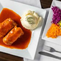 Stuffed Cabbage · Cooked cabbage leaves wrapped around pork meat and rice, cooked delicately to perfection in ...