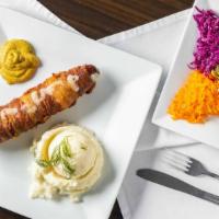 Stuffed Kielbasa · Smoked polish sausage stuffed with cheese, wrapped in bacon and served with mustard on the s...