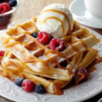 Belgian Waffle · Fresh belgian waffle served with a side of syrup and butter.