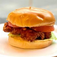 Spicy Fried Chicken Sandwich · Breaded Chicken Breast on a bun with tomato, lettuce and chipotle sauce
