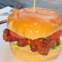 Herbed Mayo Fried Chicken Sandwich · Breaded Chicken Breast on a bun with tomato, lettuce and herbed mayo