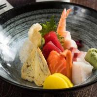 Chirashi · Japanese traditional rice bowl with variety sashimi on the top.