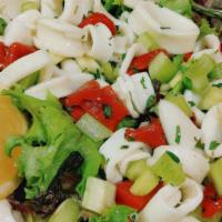 Calamari Salad · Fresh calamari tossed with celery, roasted red peppers and garlic in lemon olive oil over ba...
