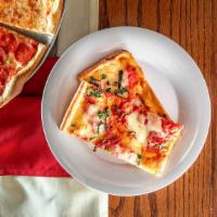 Thin Crust · Square pizza with chunks of tomato, fresh mozzarella and basil.