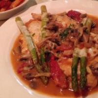 Chicken Maximo · Sauteed with fresh and sun dried tomatoes and mushrooms, in a sherry wine sauce topped with ...