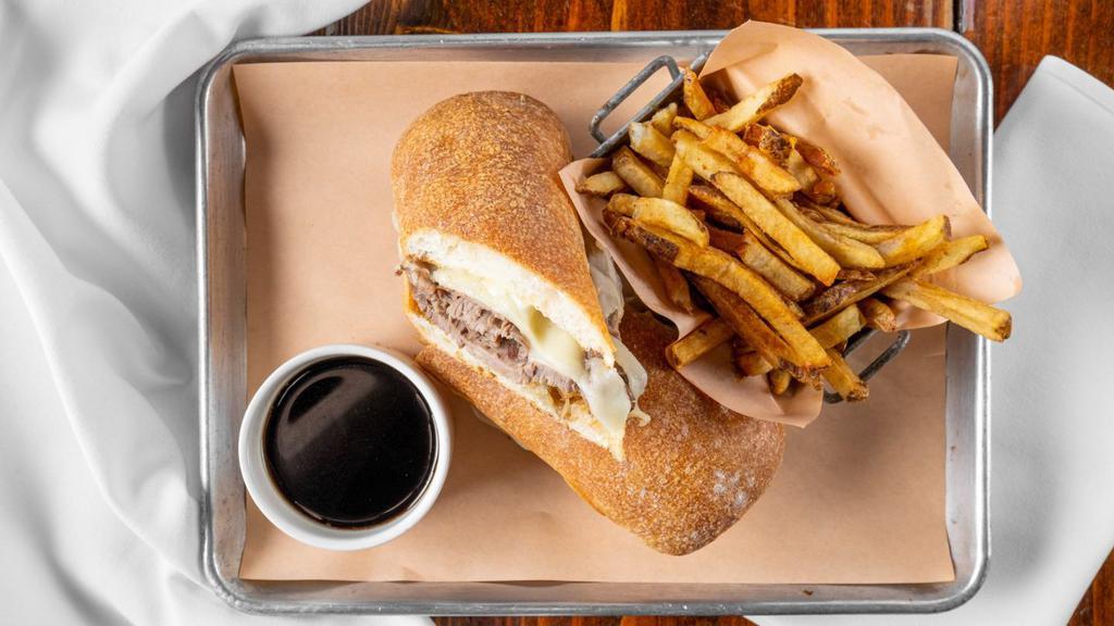French Dip · Sliced and chopped top round, caramelized onions and provolone on a toasted hoagie roll.