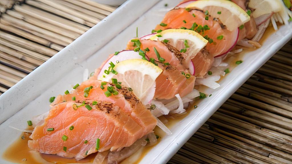 Salmon Tataki · A quickly seared salmon, thinly sliced sashimi style and served with a delicious citrus ponzu tataki sauce