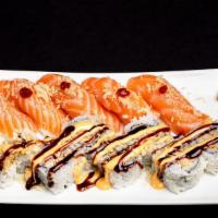 Fuji 4 · Shrimp Tempura Inside, Avocado & Crunch on top with Special Sauce, 5 pieces Salmon Sushi.