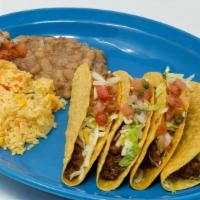 Tacos Americanos · Hard shell, seasoned ground beef, lettuce and cheese. Served with rice and beans