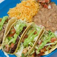 Taqueria Tacos Platter · A variety of 4 tacos: skirt steak, chorizo, pork and grilled chicken. In white corn tortilla...