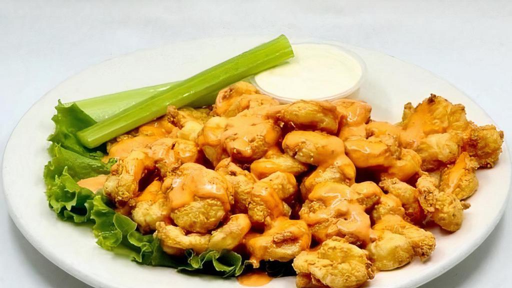 Buffalo Popcorn Shrimp · Spicy Popcorn shrimp served with Blue Cheese/ celery
