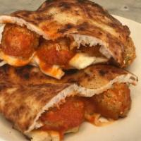 Panino Meatball · Veal meatballs, mozzarella and tomato sauce. Bread is made with pizza dough.