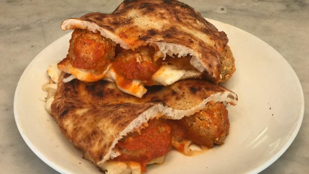 Panino Meatball · Veal meatballs, mozzarella and tomato sauce. Bread is made with pizza dough.