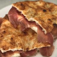 Panino Parma · Prosciutto di Parma, Arugula, Shaved Parmesan and fresh mozzarella. Bread is made with pizza...