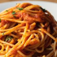 Spaghetti Al Pomodoro E Basilico · HOMEMADE spaghetti with plum tomato sauce and fresh basil.