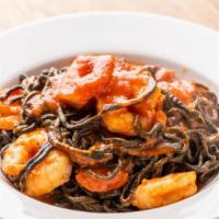 Linguine Nere All'Aragosta · HOMEMADE squid ink linguine with half lobster in tomato sauce.