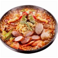 Army Stew (Boodae Chigae) · Kimchi stew with spam ham, fish cake, rice cake and ramen noodles.