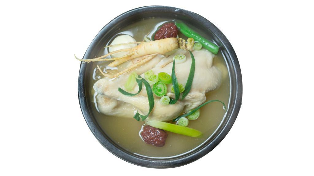 Chicken Soup (Samgye Tang) · Whole young chicken with sweet rice inside, dates, jujube, and garlic.