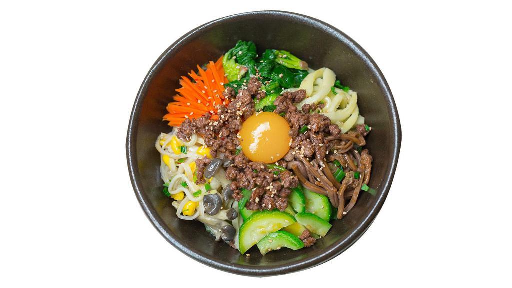Bulgoki Bibimbap · Assorted vegetables with marinated beef, fried egg on top and bowl of rice on the side.