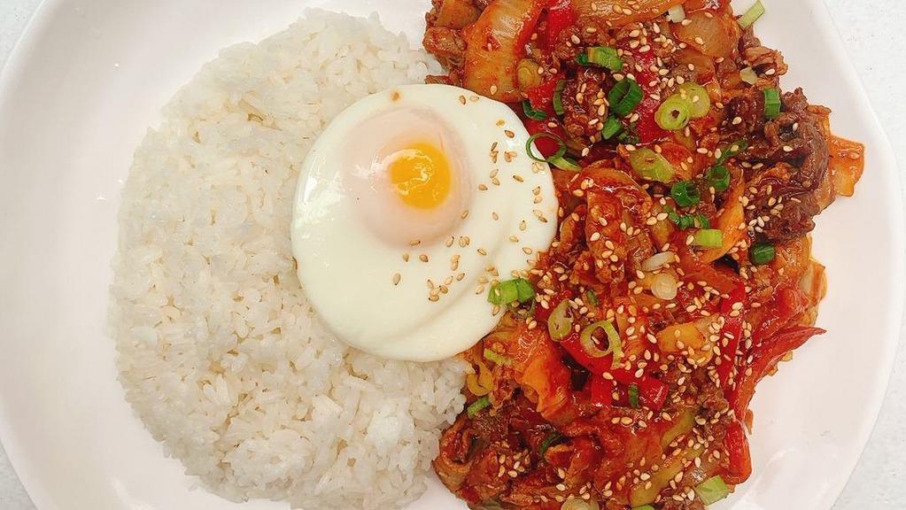 Spicy Pork & Bulgoki Over Rice · Pork and marinated beef stir fry over rice with fried egg on top.
spiciness level is adjustable.