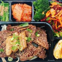 Bbq Lunch Box · Korean styled marinated beef BBQ lunch box, comes with white rice, salad, side dishes.