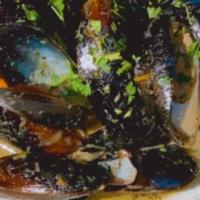 Signature Barbancourt Mussels · Barbancourt infused mussels. Served with garlic bruschetta.