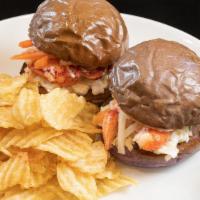 Lobster Sliders · Two lobster sliders on taro buns with coleslaw, pickled daikon, pickled carrots. Served with...