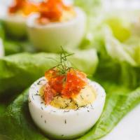 Deviled Eggs With Smoked Trout · 4 half pieces per order. Topped with trout roe.