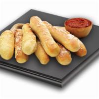 Garlic Bread · Eight pieces of bread sticks with flavors of butter and garlic, sprinkled with Parmesan chee...