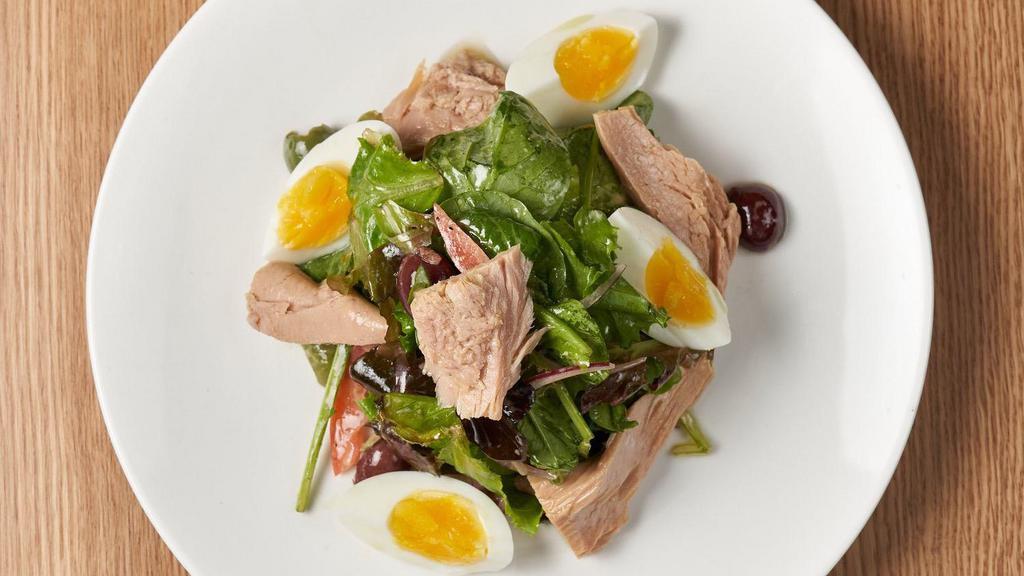 Insalata Di Tonno · Tuna marinated in extra virgin olive oil, mesclun greens, tomatoes, raw red onion, pitted castelvetrano olives, hard boiled egg, capers, mustard vinaigrette