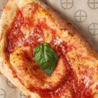 Calzone · San marzano tomato, mozzarella, prosciutto cotto, ricotta, extra virgin olive oil, and basil...