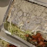 Grilled Chicken Burrito · Served on a flour tortilla filled with chicken, rice, beans, Monterey Jack cheese, sour crea...