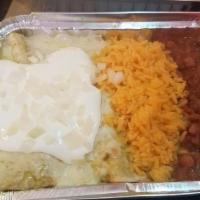 Spinach Enchilada · 2 corn tortillas topped with melted cheese, sour cream, and onions, served with rice and bea...