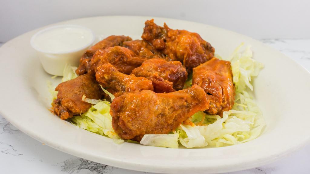 Buffalo Chicken Wings · Hot sauce with butter, spices and deep-fried. Served with celery and blue cheese dressing.