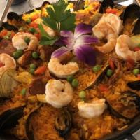 Paella Marinera · Gluten-free. Shrimp, scallops, calamari, mussels, clams. Paella - Spain's classic saffron ri...
