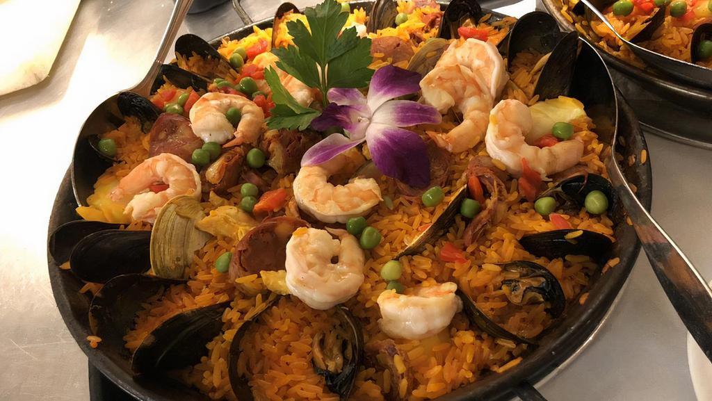 Paella Marinera · Gluten-free. Shrimp, scallops, calamari, mussels, clams. Paella - Spain's classic saffron rice dish.